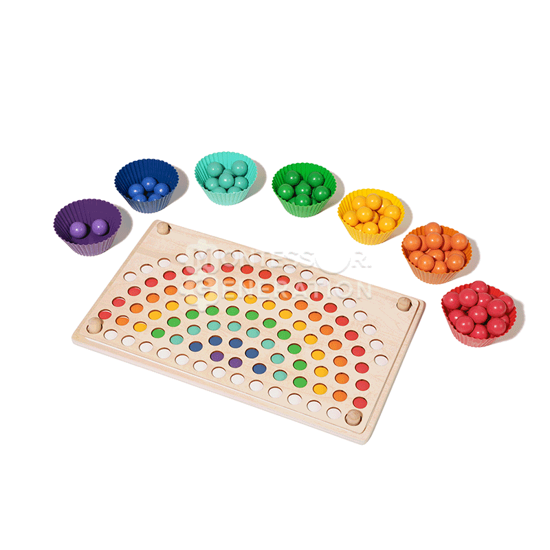 Stop motion showing multicolor beads appear on a wooden board in a rainbow shape.