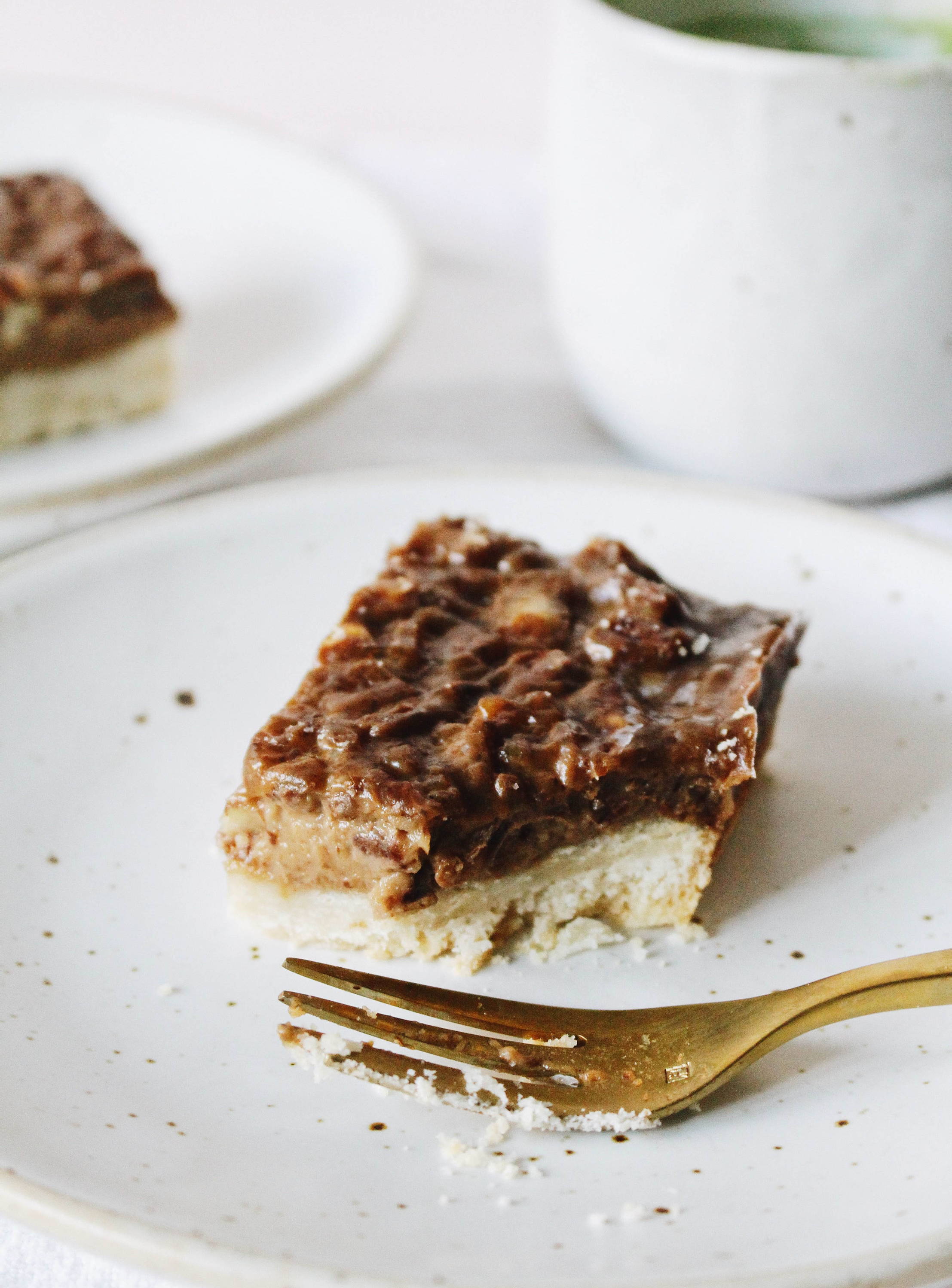 Pecan Pie Bar on a plate with a fork