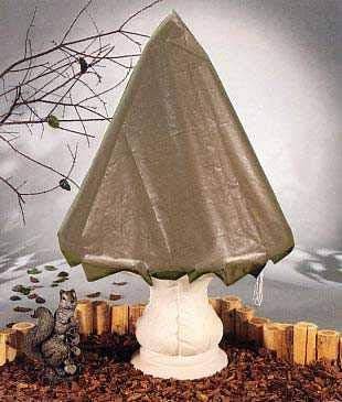 Shop a fountain cover protecting a garden fountain from freezing temperatures