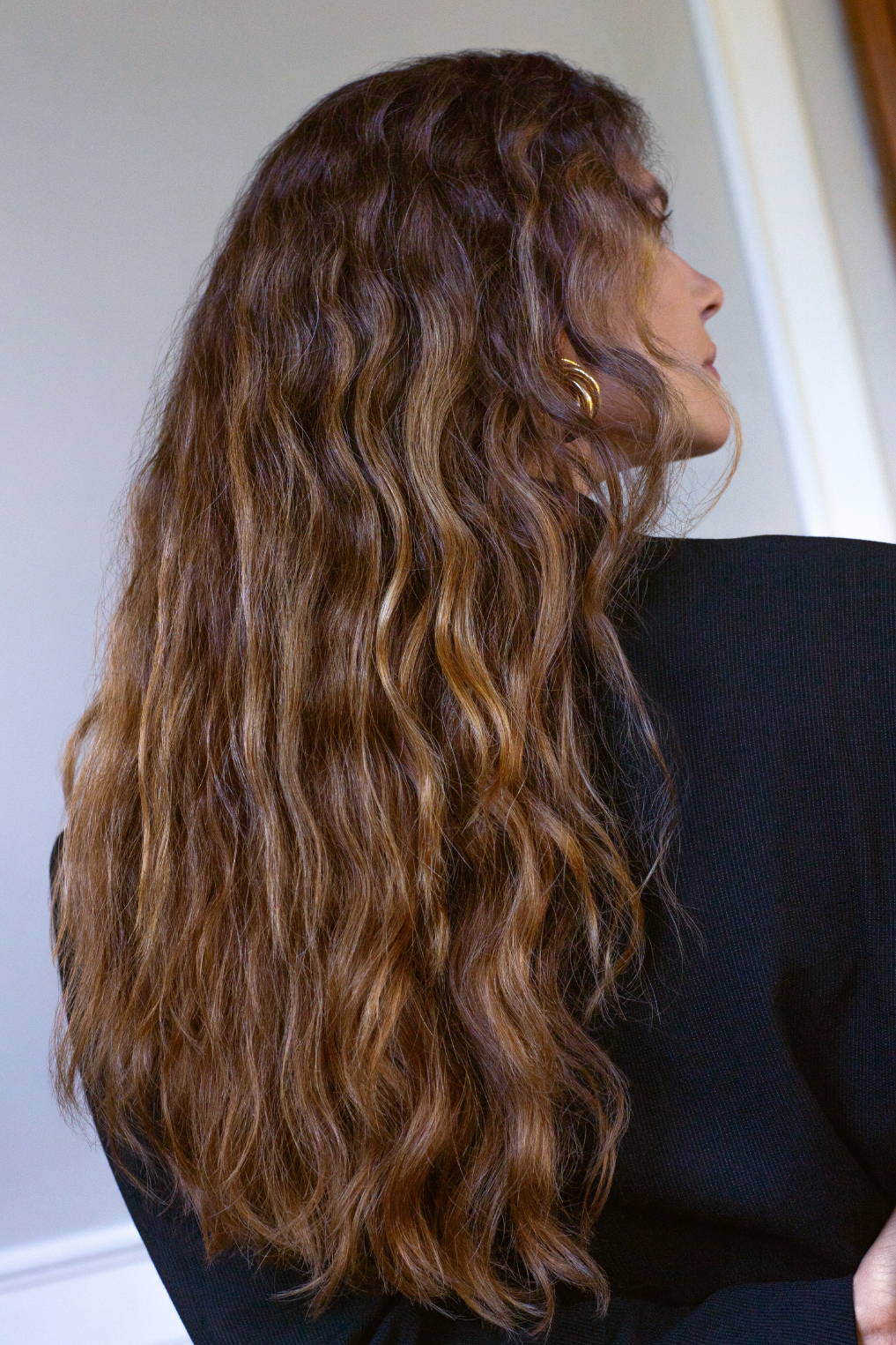Davines model with long, wavy hair