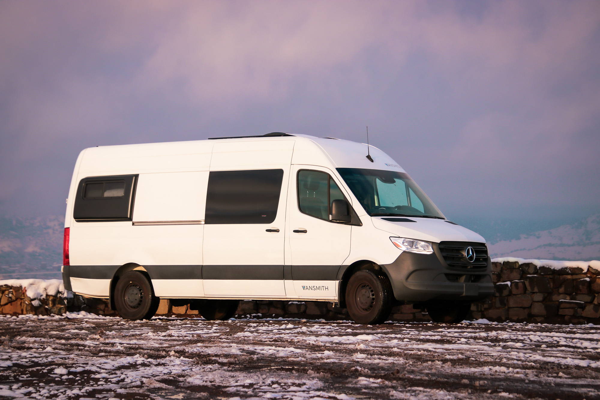 Rack & Roll - Sprinter 144 Conversion Van - Man in Under-Bed Storage Area with Shelves - The Vansmith