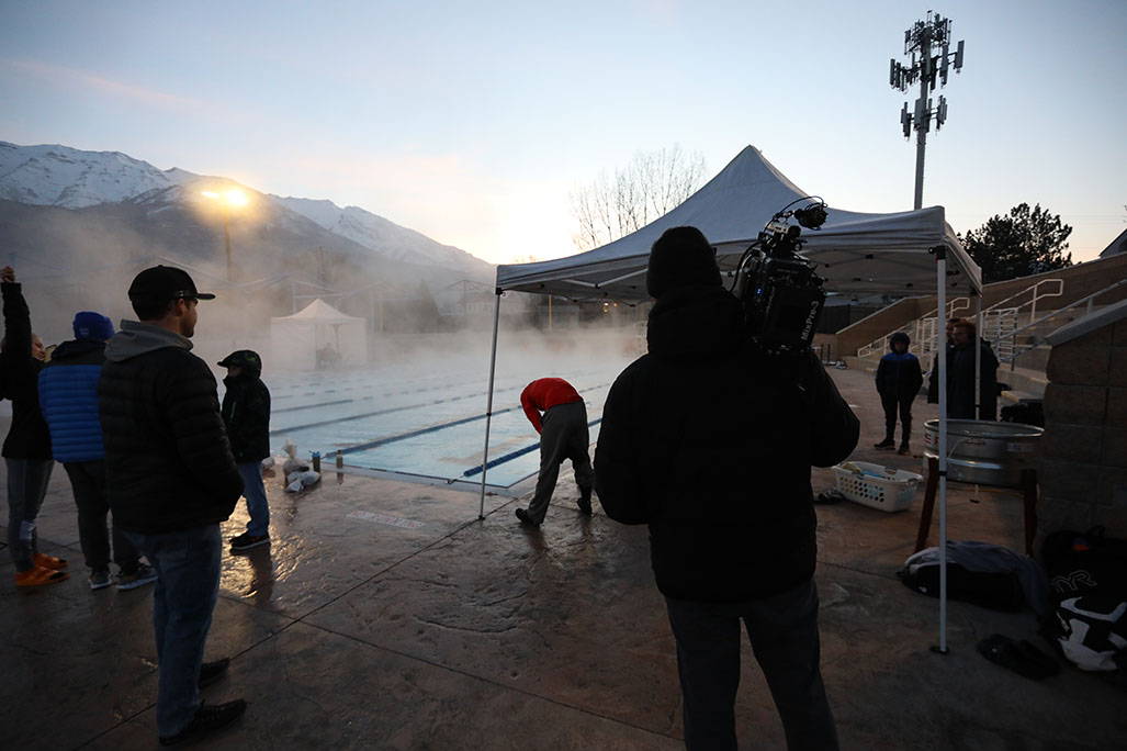 Foggy pool with small crowd