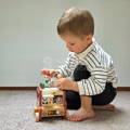 Child playing with the Montessori Smart Safari Bus.