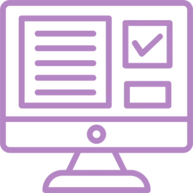 A person sitting at a desk, working on a laptop with charts and graphs displayed on the screen.