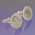 silver cufflinks featuring the foot and hand print form a little baby born asleep. 