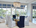Image is the driftwood dining table and Oyster Shell Chandelier.