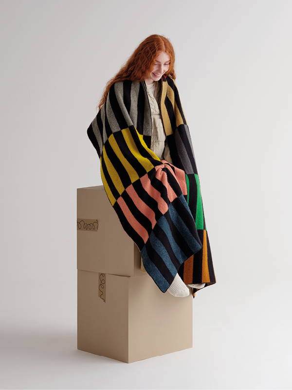 model wears   Large Multicolour Rectangles Brushed Blanket Scarf Multicolour