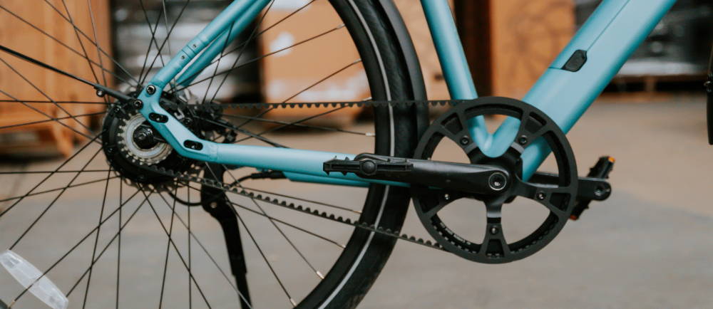 closeup of a wheel and rear stay of a belt drive bike