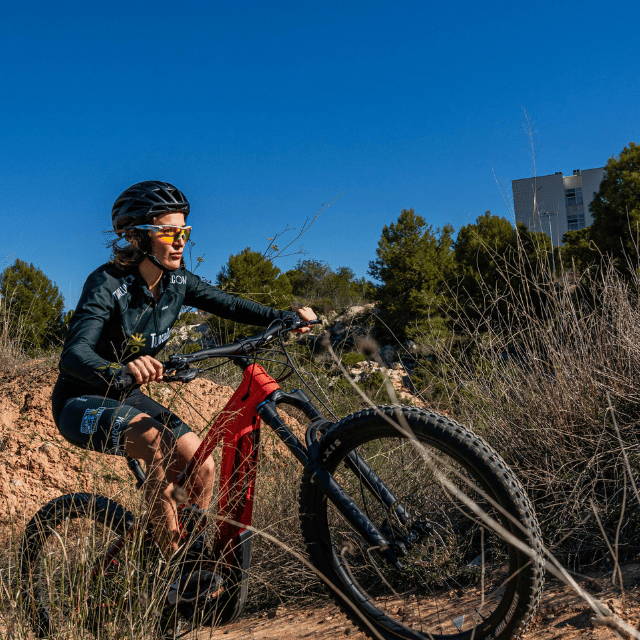 a woman on an electric mountain bike