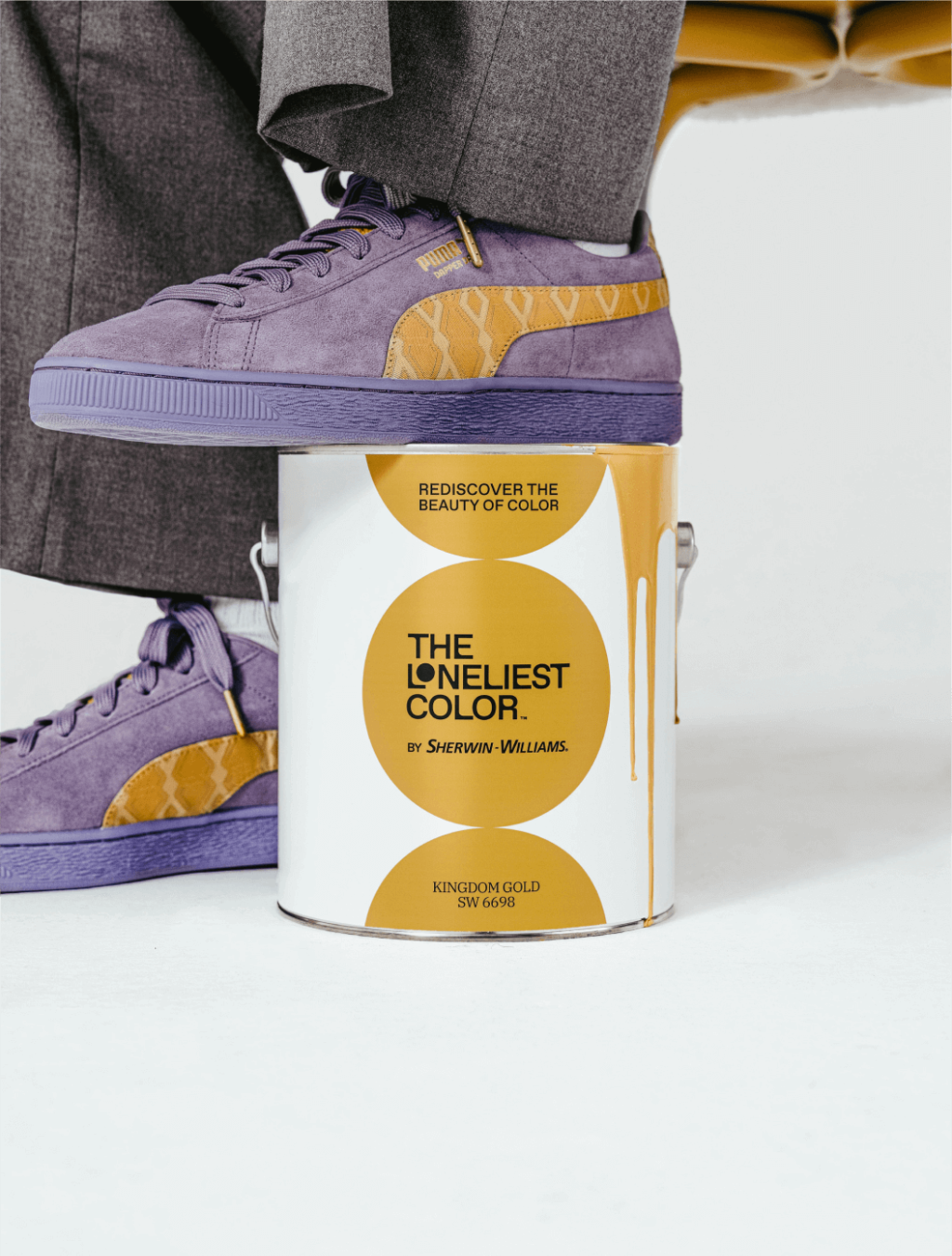 Purple and Kingdom Gold shoes with one foot.png
