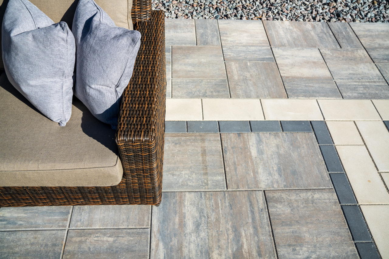 Patio made with Discover Paver Set with a double Border and a patio chair.