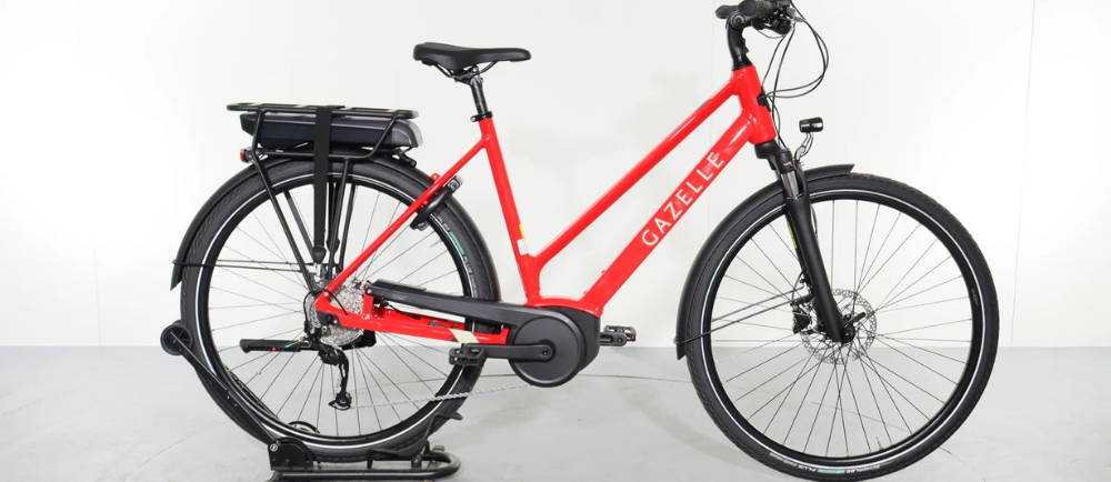 A gazelle e-bike on a stand
