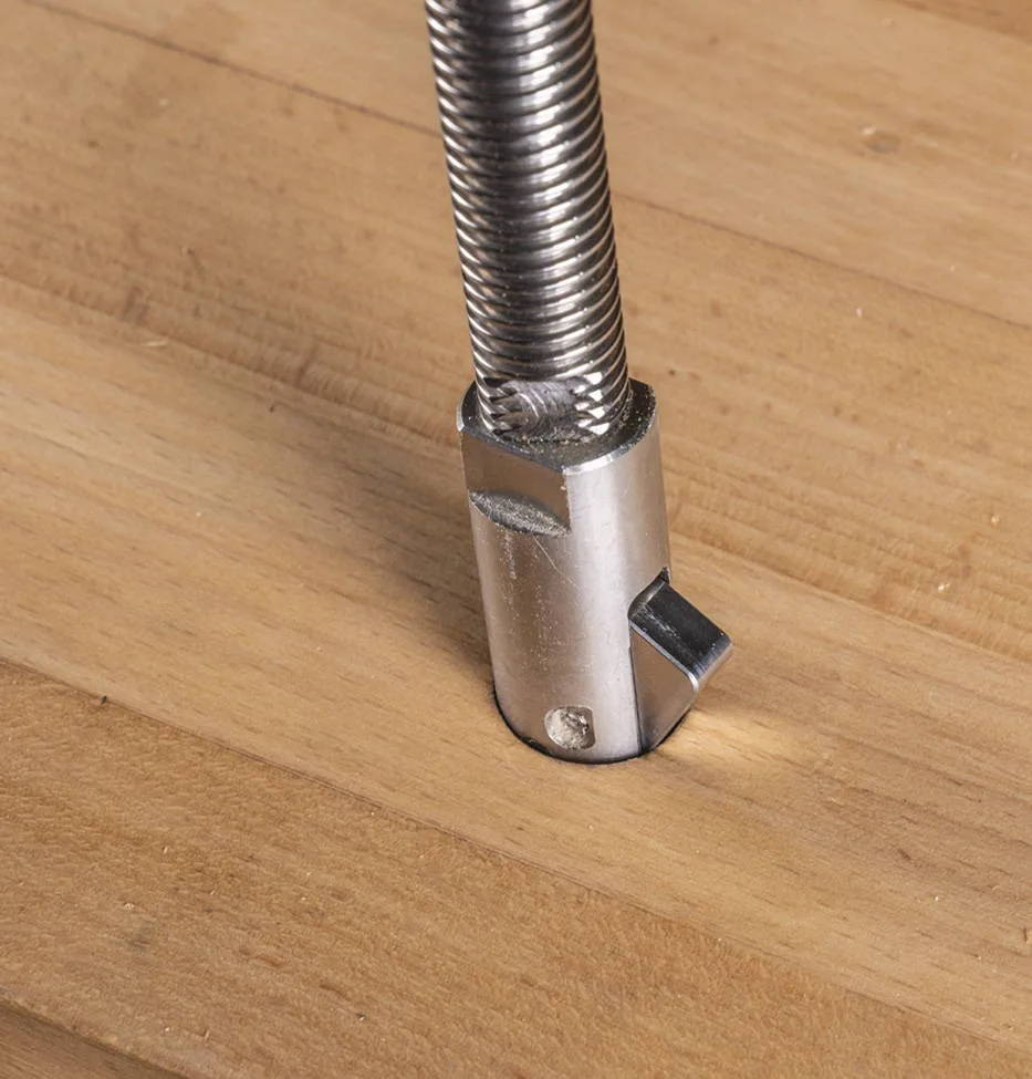 So when using the harvey Compass ah 3 arch hold down, you simply insert the pillar shaft of the Compass ah 3 arch into a dog hole, the latch on the end of the shaft will automatically flip over (by off-center gravity) when it passes the bottom of bench top.