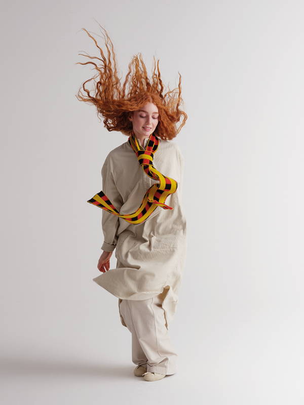 model wears Long Check And Stripe Brushed Scarf Black & Red Dulse