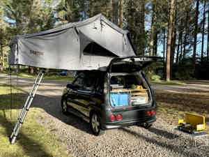 Selfcontained car with rooftop tent
