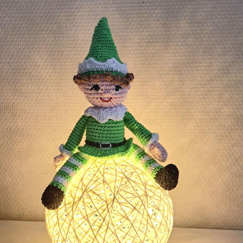 Elf on a Christmas ornament or LED lamp