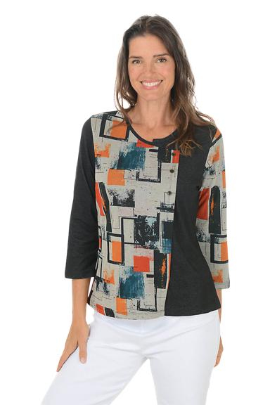 A woman wears a button knit top.
