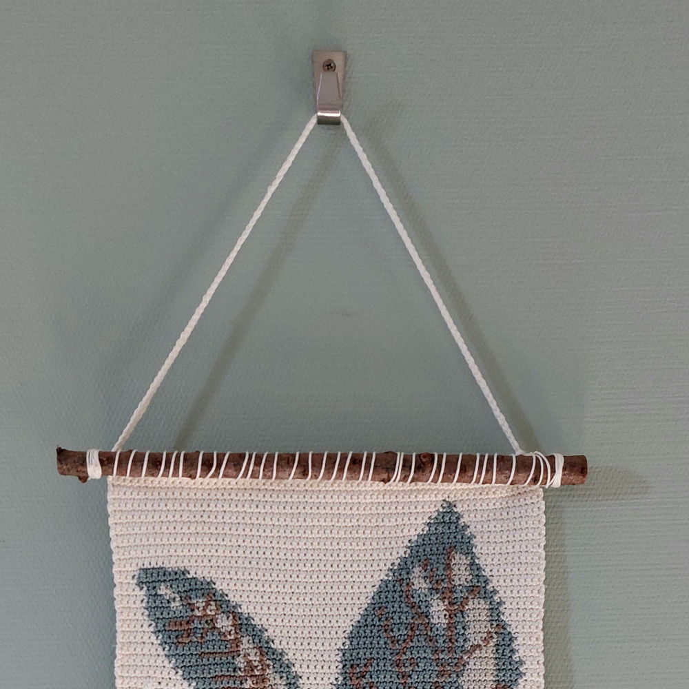 Wall hanging with leaves
