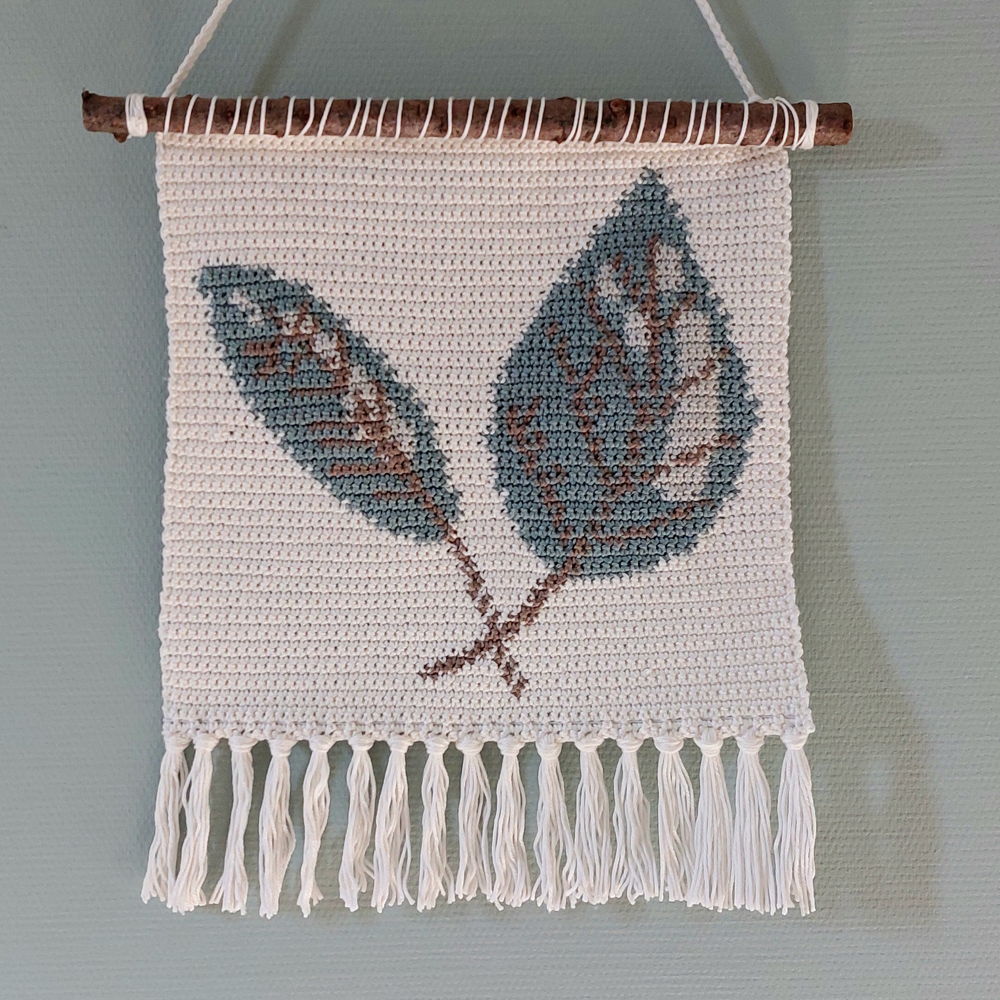 Wall hanging with leaves