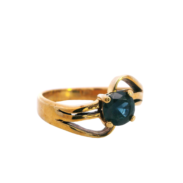 Enigmatic Sapphire Cross-Over Ring