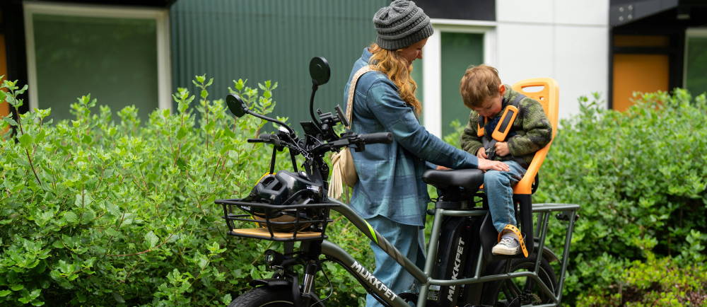 Mother with child on electric cargo bike