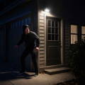 burglar-triggers-motion-sensor-light-on-house burglar-triggers-motion-sensor-light-on-house
