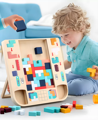 Little boy playing with wooden Montessori Tetris toy. 