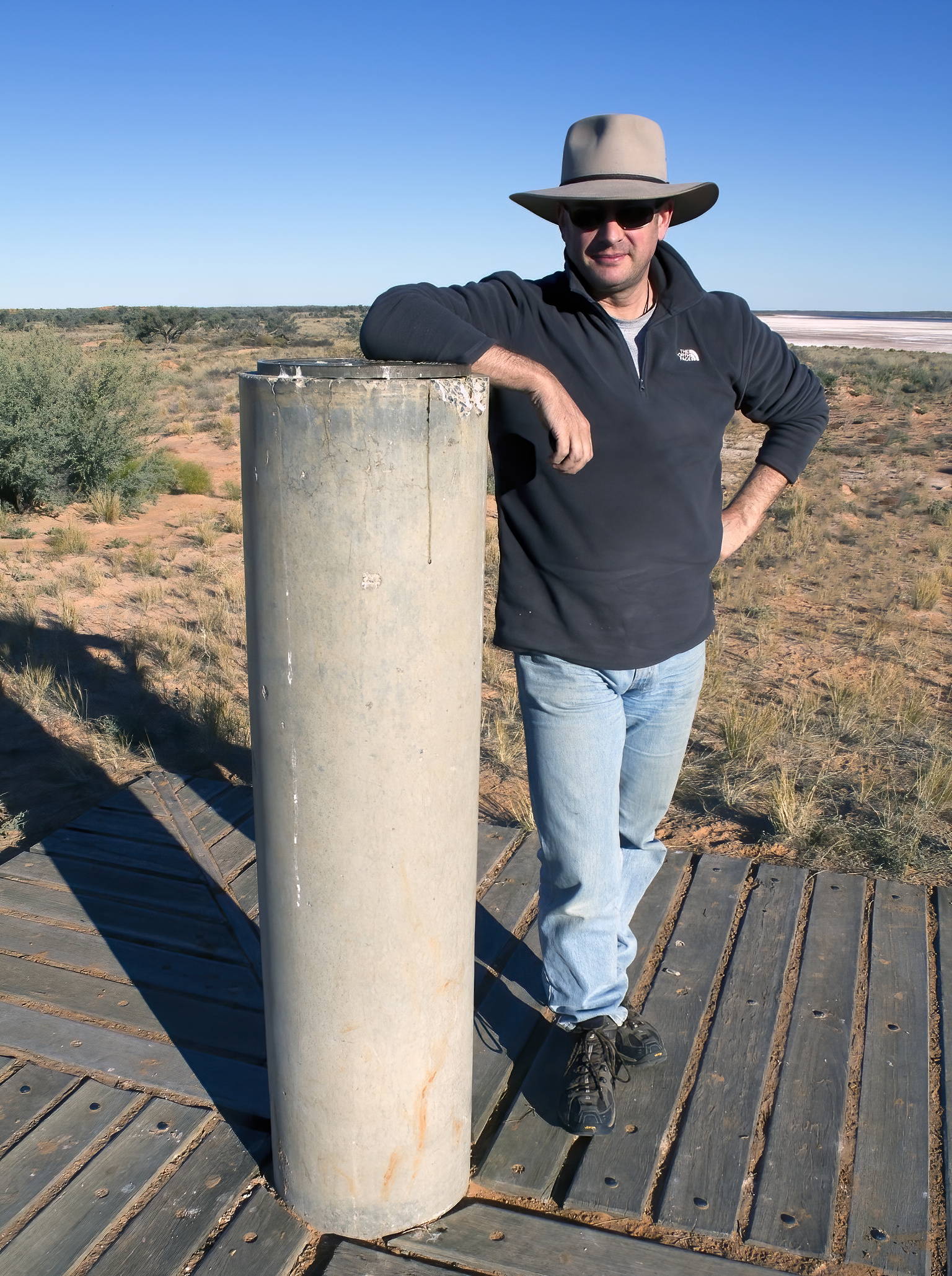 The author posing at Poeppel Corner - where Queensland, South Australia and the Northern Territory borders meet.