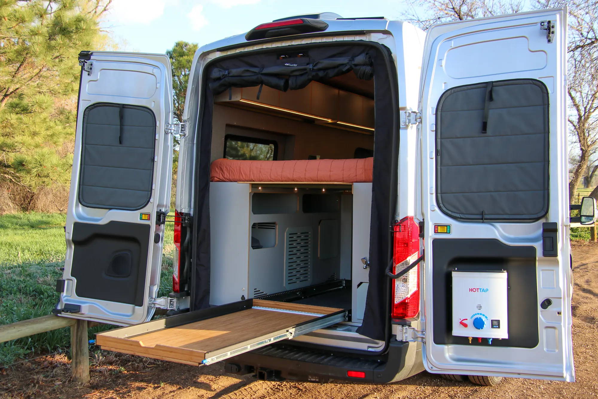 Storage Tray Extending from Rear of Ford Transit Conversion Van by The Vansmith