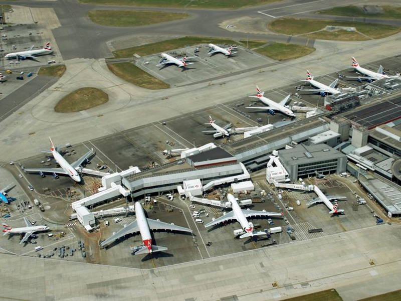 Image may contain: Airport, Aircraft, Airplane, Transportation, Vehicle, Car, Architecture, and Building