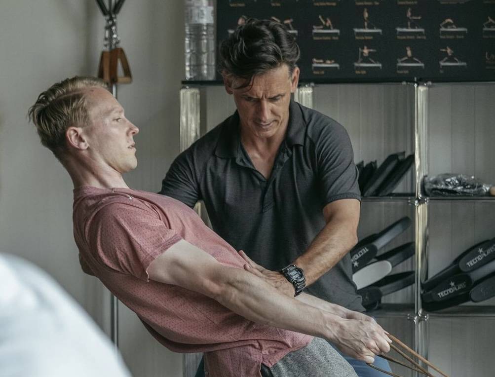 Miguel Silva teaching a client on the Gratz Reformer in his studio