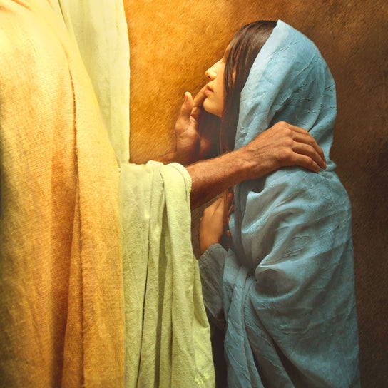 Jesus comforting a young woman in a blue robe.