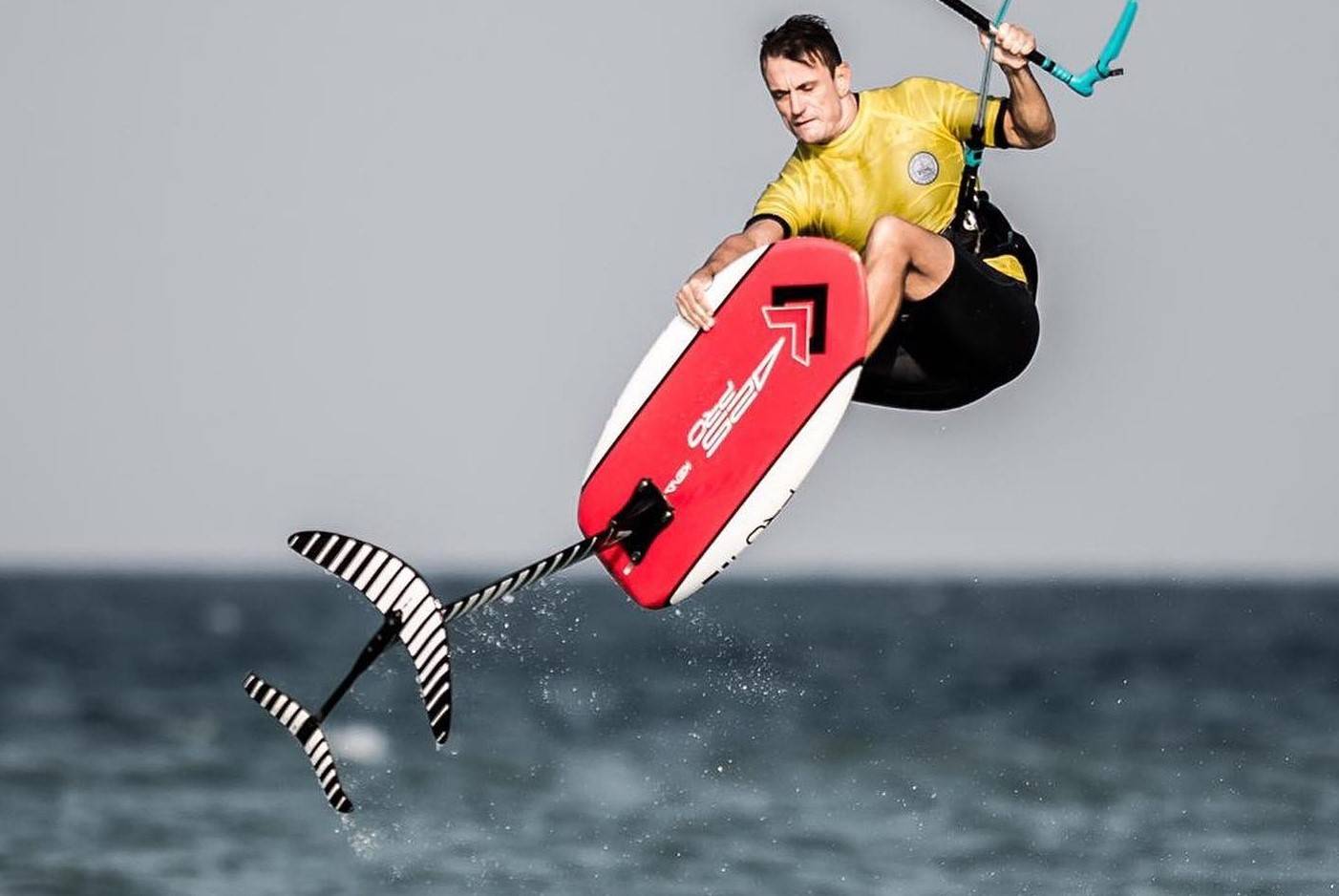 425pro K.W.T. board which stands for Kite foil, Wake foil and Tow foil board. A man in action. 