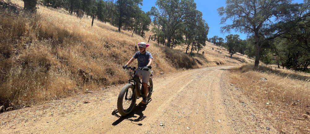 a man riding an aventon aventure electric bike while on a tour with Yosemite E-Biking (yosemiteebiking.com)