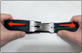 Hands pull the watch band outward from both sides to release the clasp adjustment tab.