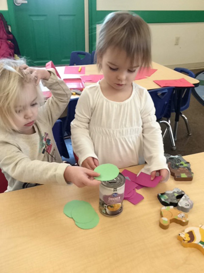 2 year olds are working on shapes at Primrose School daycare 