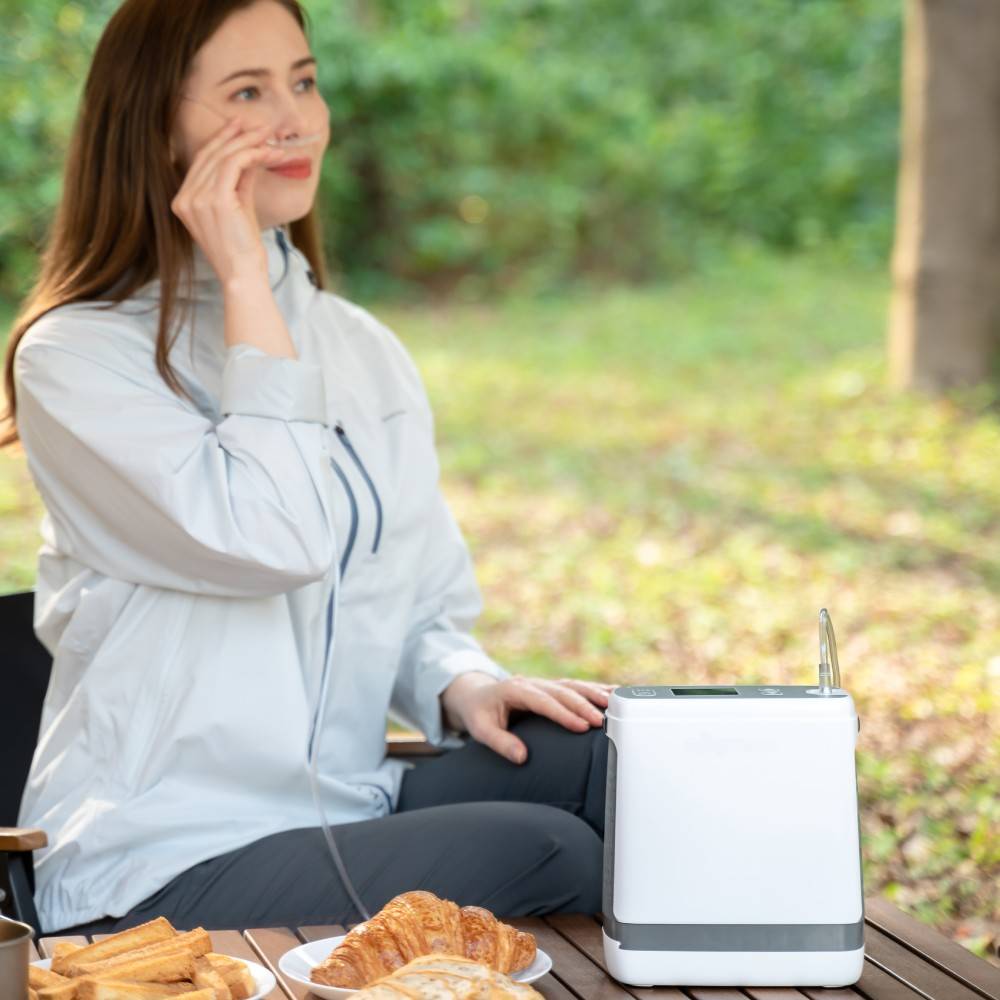 Picknicken im Park mit einem tragbaren Sauerstoffkonzentrator