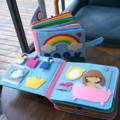 Two Montessori Story Books placed on a table, one is showing the front page while the other has different decorations.