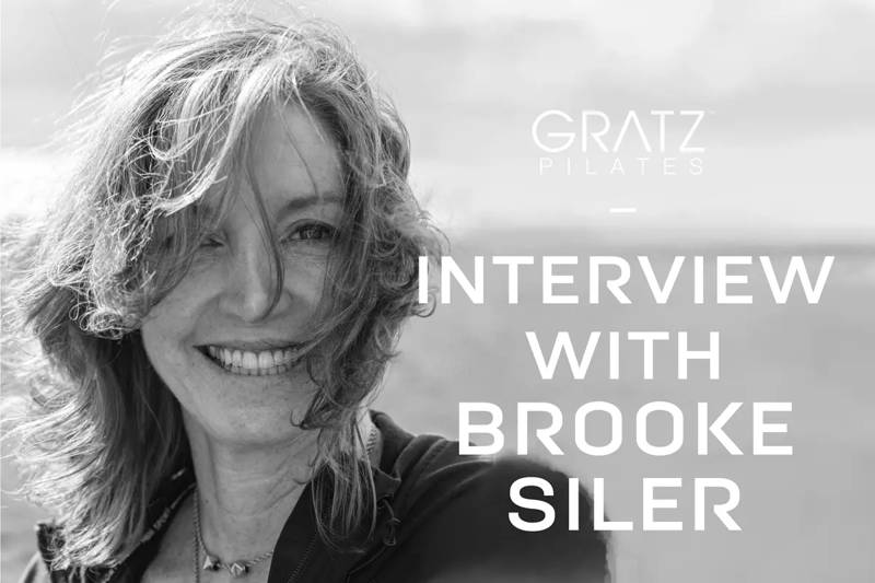 A black and white closeup shot of Brooke Siler smiling at the Camera