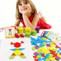 A little girl in a red dress lying in the back, while Montessori Shape Puzzles are spread out in front of her. 
