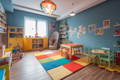 A tidy and colorful children's playroom. 