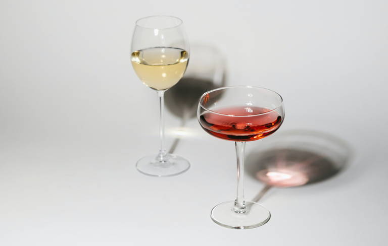 Two glasses of sweet wine, including white and rose. 