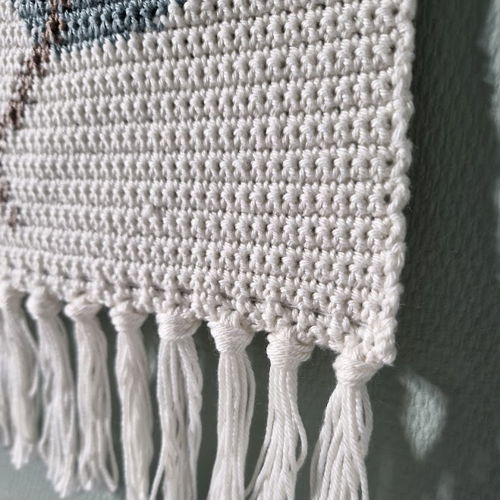 Wall hanging with leaves