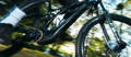 Rider on electric mountain bike on forest path