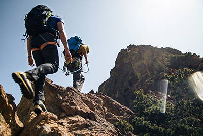 Hikers going up a mountain.