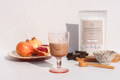 Vegan Protein and Collagen powder in a glass with fruits