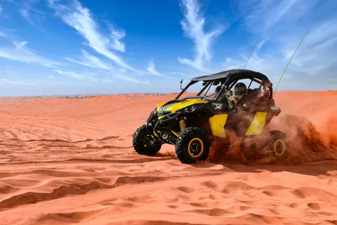Riding quad bikes or buggies in the open in the desert Lah Bab