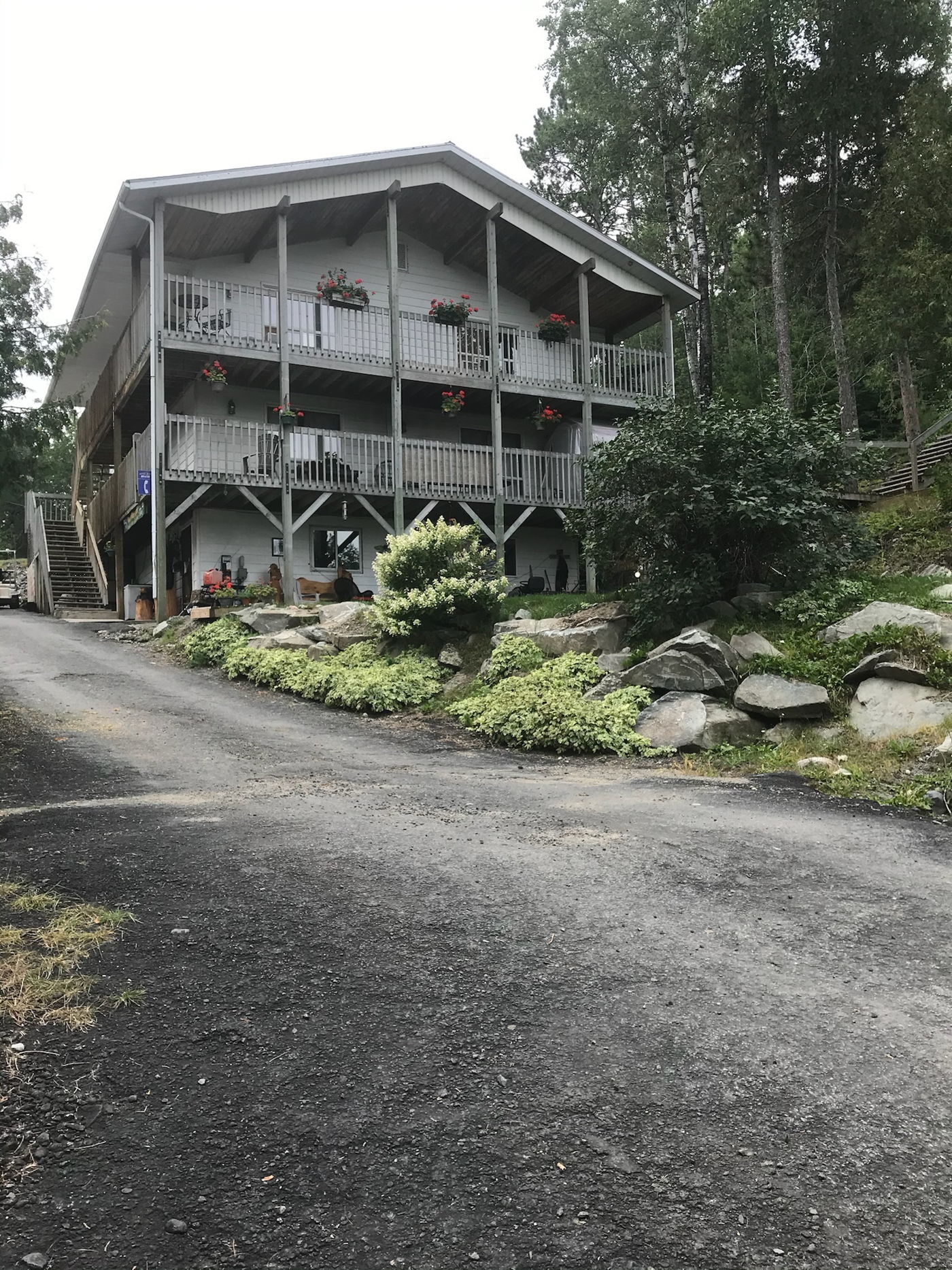 Two-story lodge with covered porches at Muskie Bay Resort