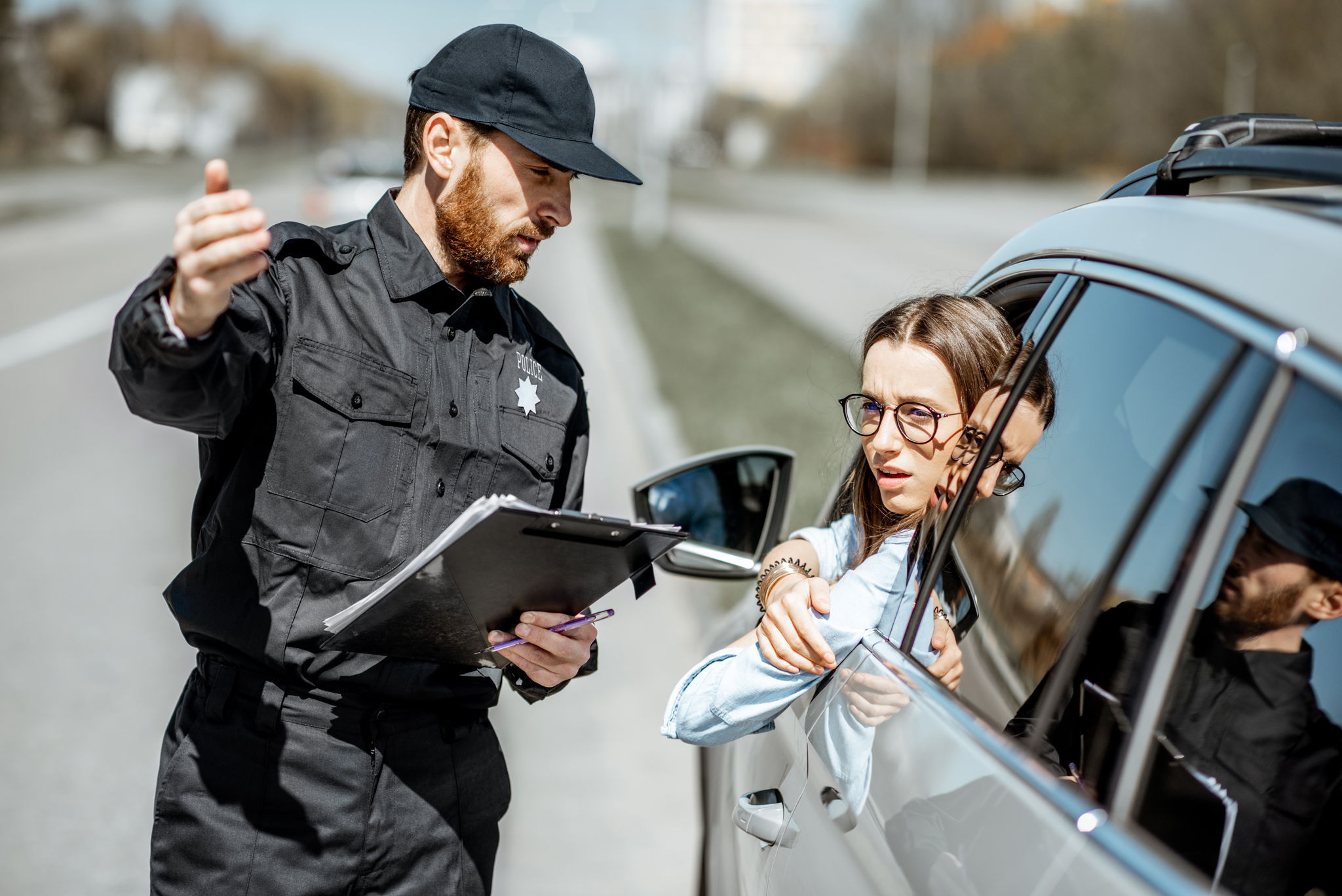 cop giving a ticket to female driver