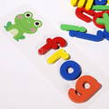 An example of placing wooden letters on a card when playing the Montessori Wooden Spelling Game, a colorful children's toy.